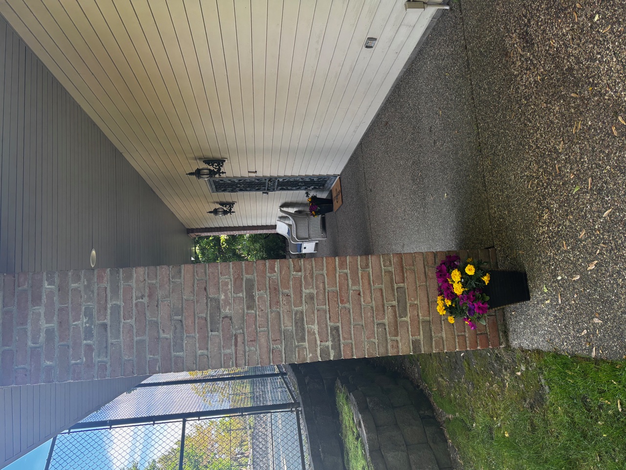 Covered porch entrance with seating