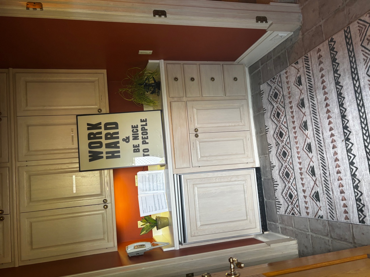 Work Hard & Be Nice to People sign in the studio kitchen
